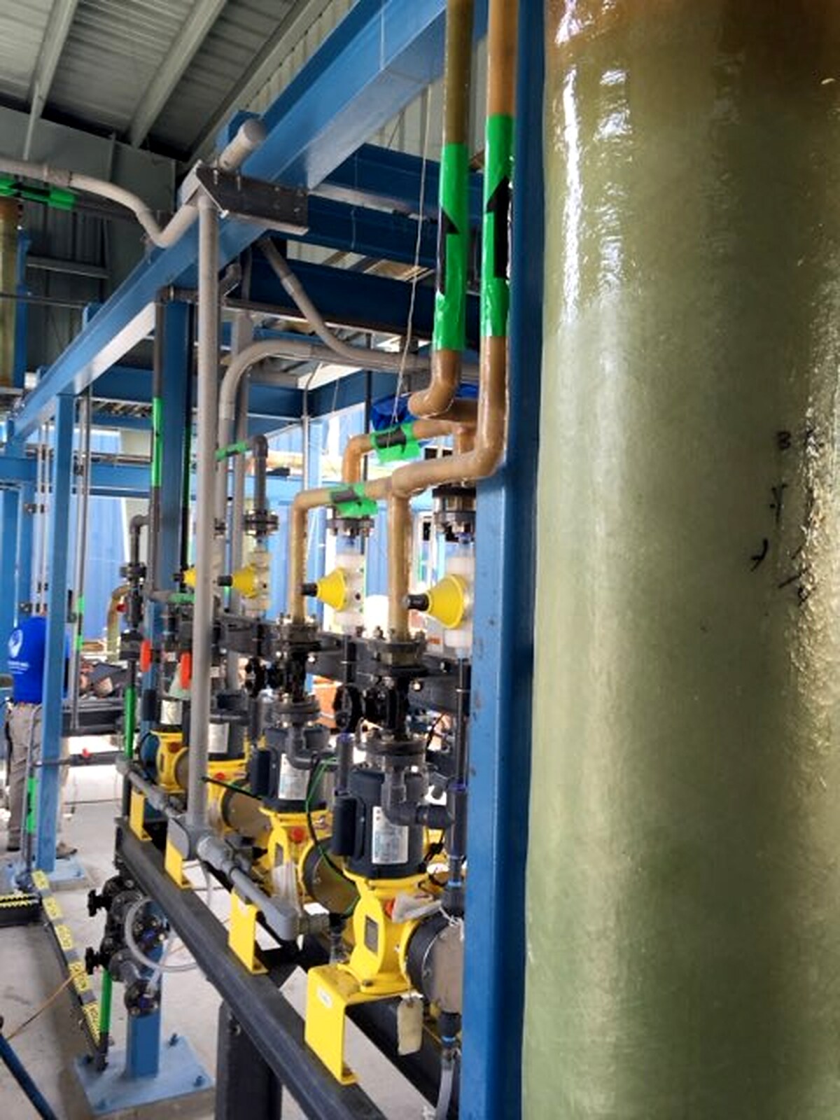 Process piping, pumps and valves inside a chemical plant