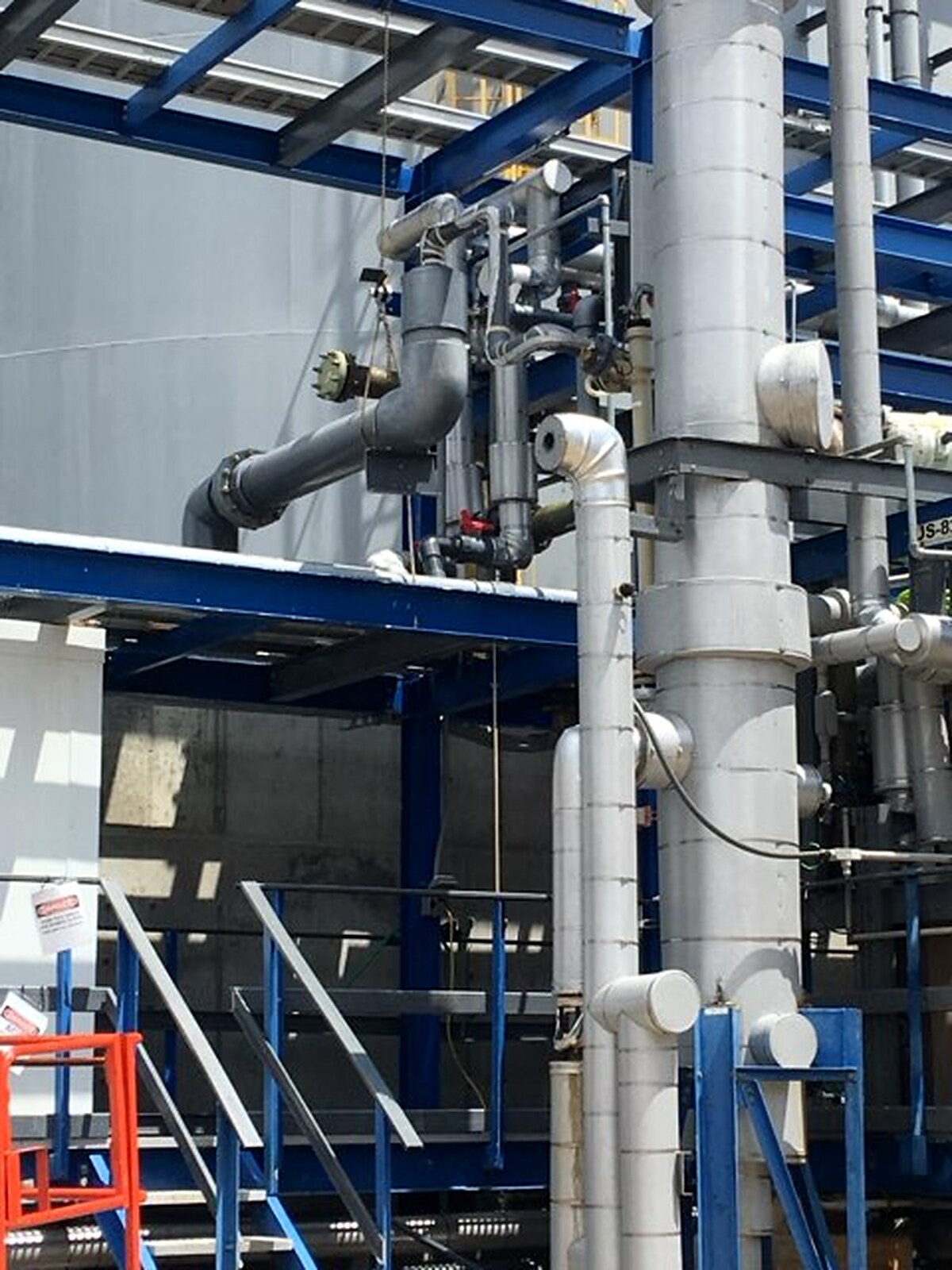 Steel process piping supported on a plant pipe rack